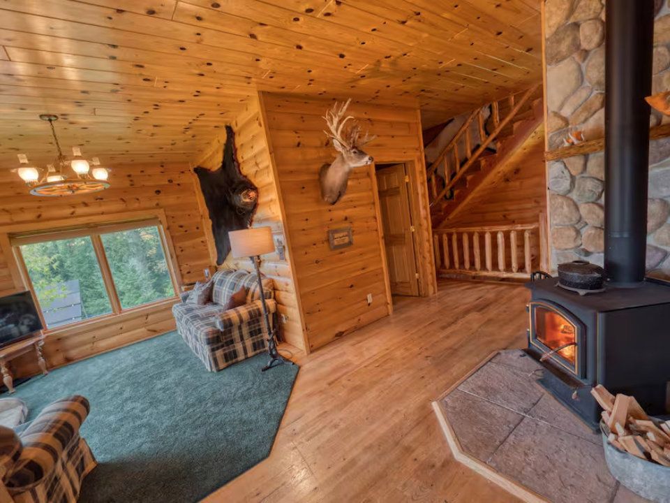 Lost lake fair chase hunts cabin living room and fireplace